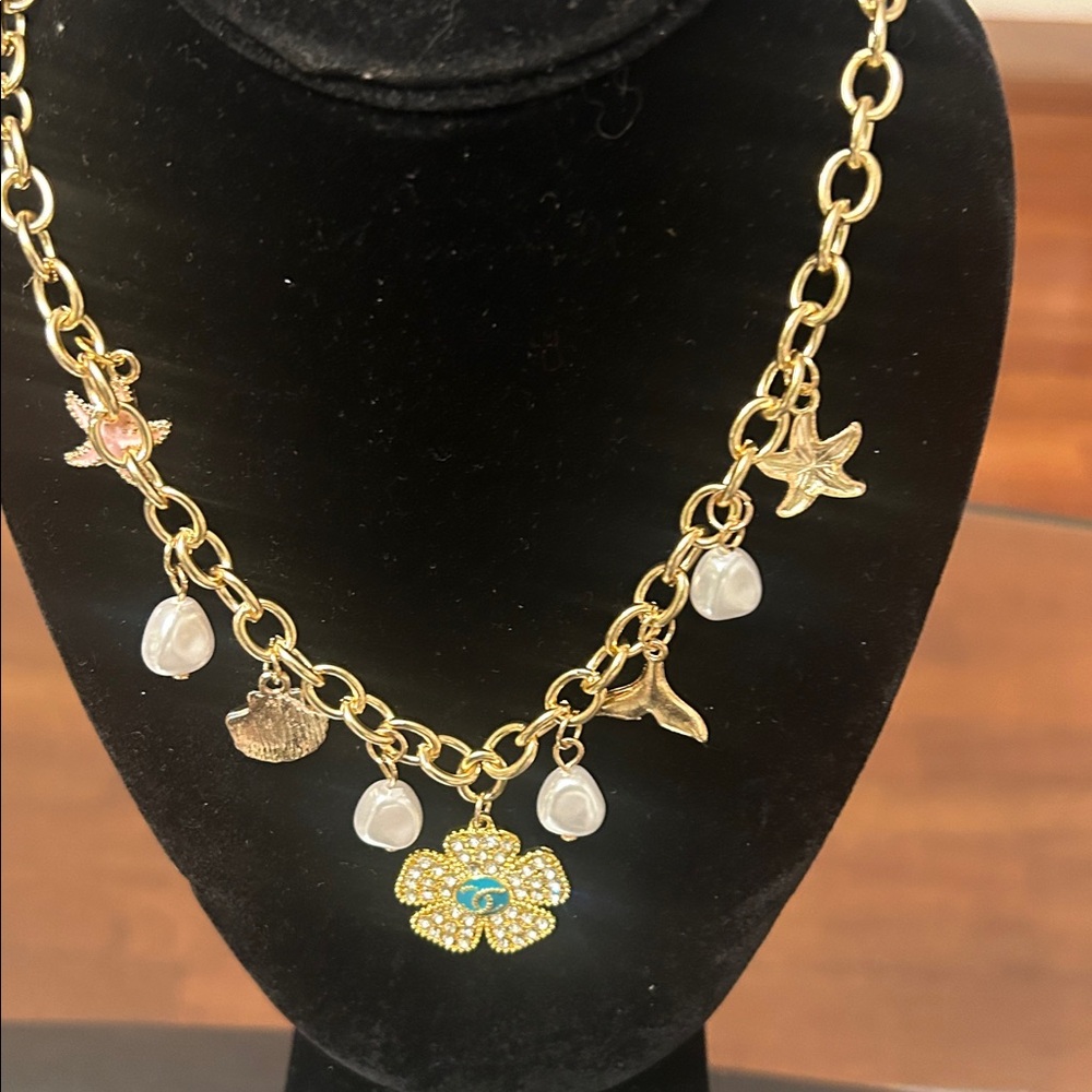 Gold Toned Floral Charm Necklace with Pearlescent Accents